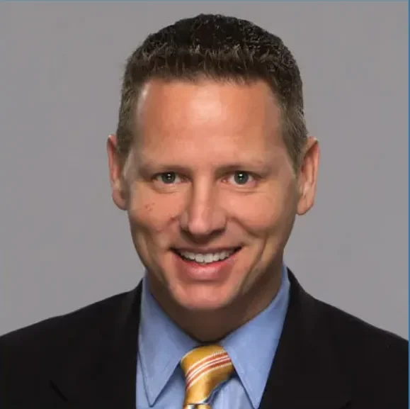 chuck norman, s&a communications headshot in suit and tie